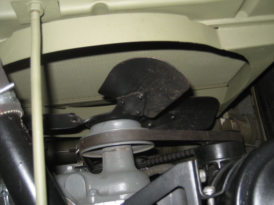 1979 Ford Bronco engine bay showing fan, radiator, and belt