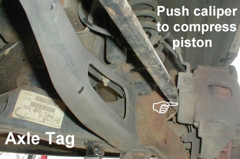 1983 Ford Bronco - If the rotors (BRR56 / BRR207) are heavily scored or lipped, it will be necessary to compress the caliper with a prybar before swinging the…