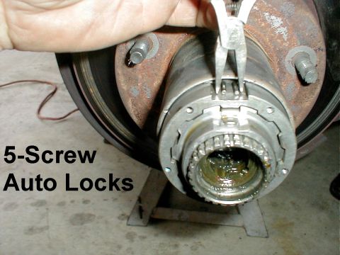 1983 Ford Bronco - After removing the bridge clip, compress the lock body retaining ring on 5-screw auto lock, then remove the lock body & the ring together.…