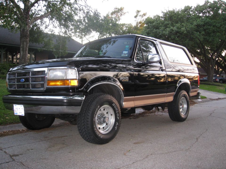 1994 Ford Bronco, black with tan trim, 3/4 front view