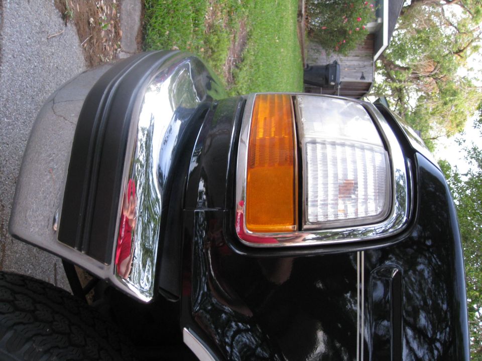 1994 Ford Bronco front passenger corner with chrome bumper and headlight