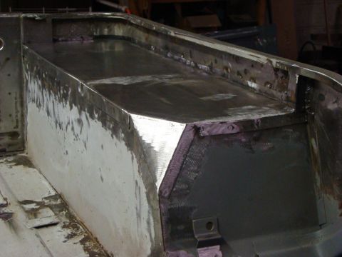 1948 Jeep Wrangler - Metal bed of a vehicle undergoing repair and welding work.