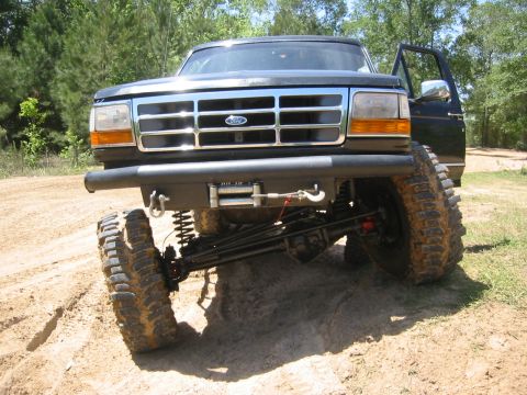 1995 Ford Bronco - This lifted 1995 Ford Bronco features aggressive off-road tires and a front winch, ready for terrain.