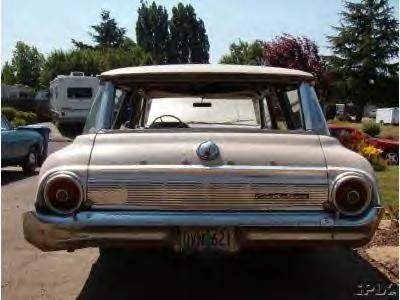 1964 Ford Custom Wagon - This station wagon's rear design, including the taillights and grille, suggests a 1960 model year, not 1964.
