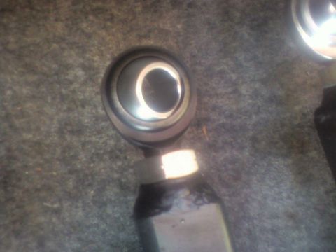 1992 Ford F-350 - A close-up view of a suspension ball joint, likely a replacement part, is shown against a carpeted background.