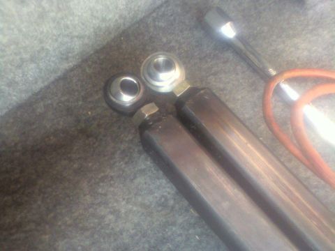 1992 Ford F-350 - Close-up of suspension parts and tools, likely for automotive repair or modification.