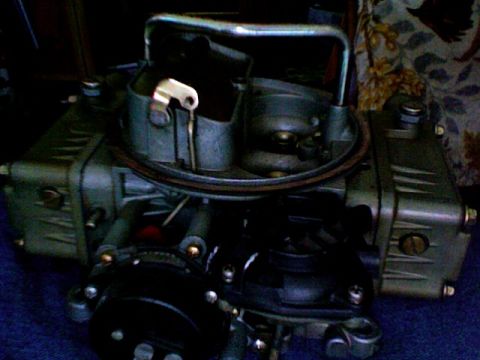 1979 Ford Bronco - Close-up of a Holley carburetor, a common engine component.