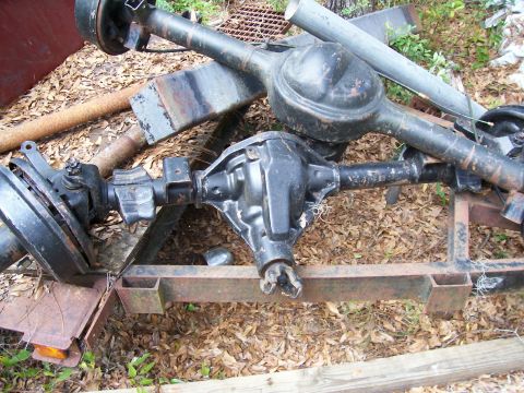 1990 Ford Bronco - Two rear axle assemblies are shown on a trailer, with one in the foreground and another behind it.
