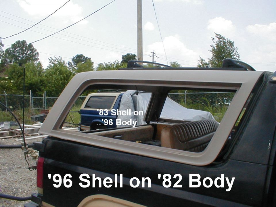 Rear quarter window glass on black SUV with text overlay '96 Shell on '82 Body