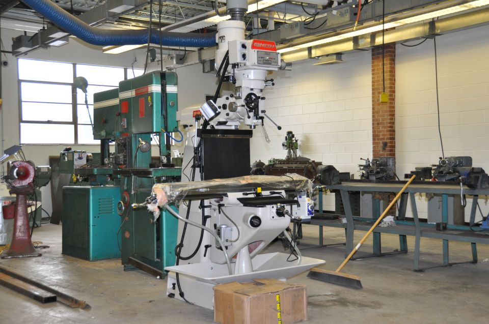 Industrial workshop scene with milling machines and lathes