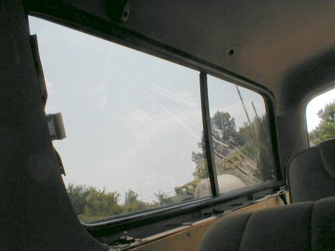 1983 Ford Bronco - Pounding on the glass along the edges will let the gaskets settle into place. The edges of the headliner go behind the gaskets.