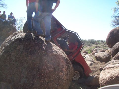 2004 Aston Martin Virage - Off-road vehicle becomes stuck while navigating a rocky terrain.