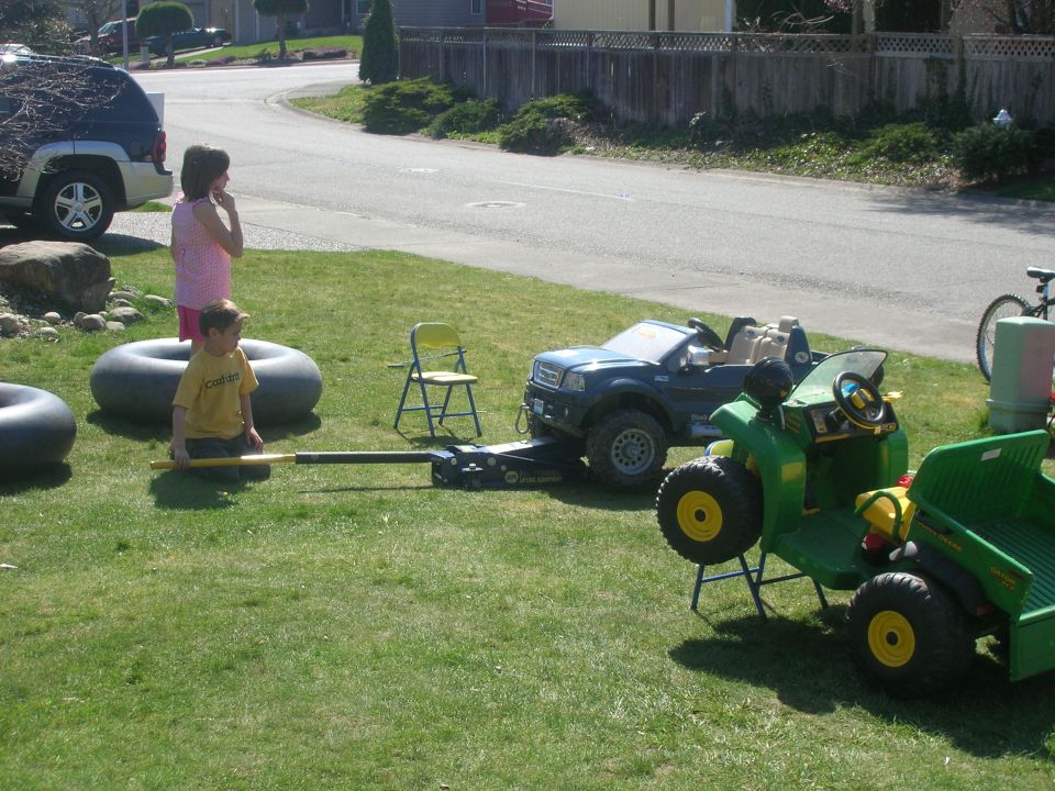 Boy with toy truck and tractor