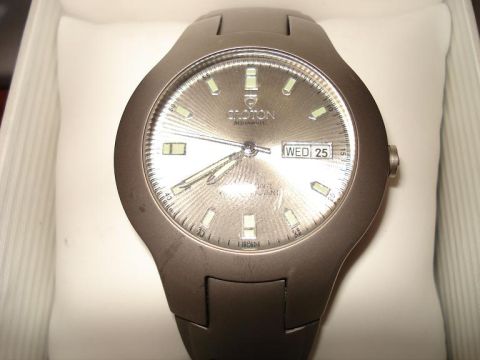 2000 Ford Crown Victoria - A close-up shot of a men's analog wristwatch with a date display.