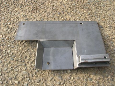 1996 Ford Bronco - A custom-fabricated metal bracket with a small box-like extension is shown mounted on a flat surface. The bracket has several holes drilled…