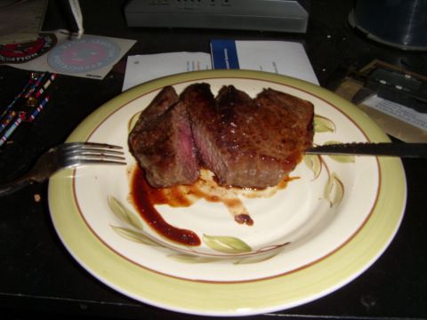 1978 Ford Bronco - A close-up view of a cooked steak served on a plate, ready to be eaten.