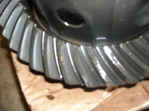 1979 Ford F-150 - A close-up view of a differential ring gear, showing its metallic teeth and a dark, circular opening.