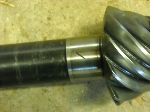 1979 Ford F-150 - Close-up of a differential pinion gear and shaft, showing wear marks and a scratch on the shaft.