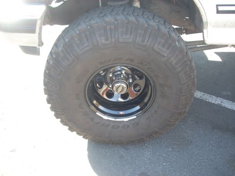 1992 Ford Bronco - A close-up shows a tire and wheel assembly on a vehicle.