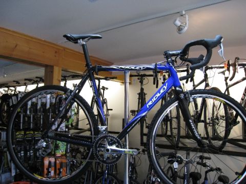 1972 Ford Ranchero - A bicycle is displayed in a shop with many other bicycles.