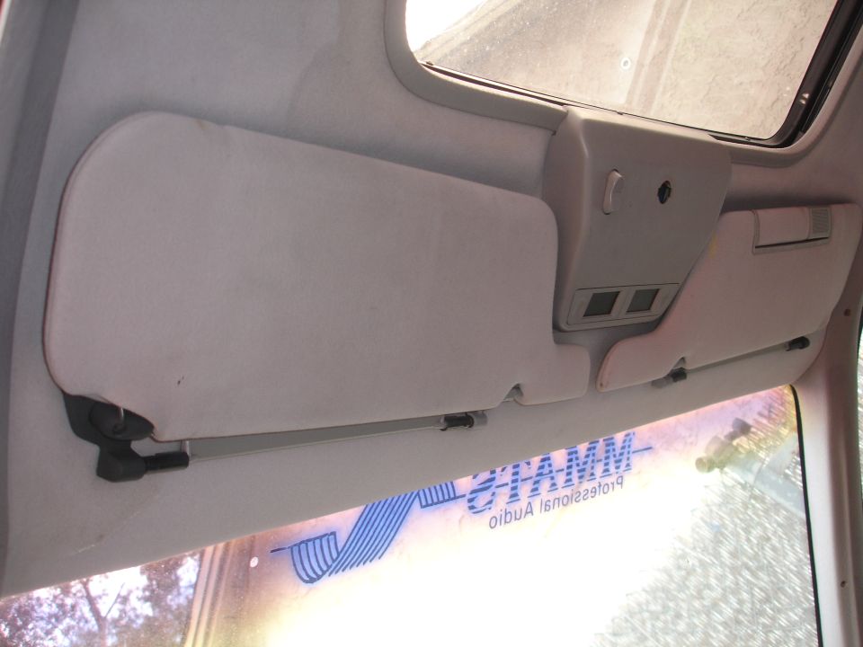Interior view of sun visors and overhead console in a 1989 Ford Taurus