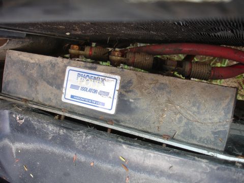 1989 Ford Taurus - Phoenix battery isolator with red cables attached, handcrafted in the USA.