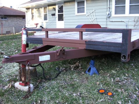 2005 Ford F-250 - Trailer hitch and frame shown with a wooden deck and jack stand.