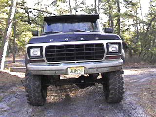 1990 Ford Bronco - This Ford Bronco from the 1980-1986 generation is shown from the front, a prominent black grille and a yellow license plate.