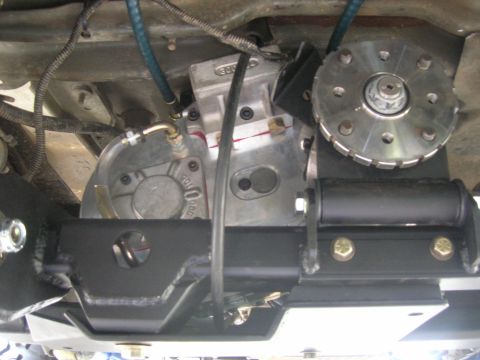 1996 Ford Bronco - Close-up of vehicle drivetrain components, including transmission and associated hardware.