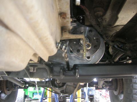 1996 Ford Bronco - Close-up view of the undercarriage, highlighting the transmission and drivetrain assembly.