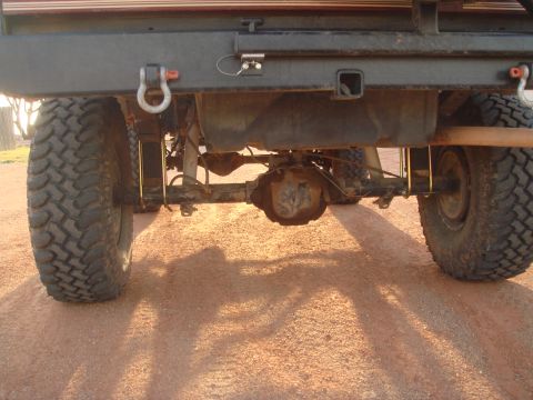 1992 Ford Bronco - Close-up view of the rear axle and suspension components of a modified truck.