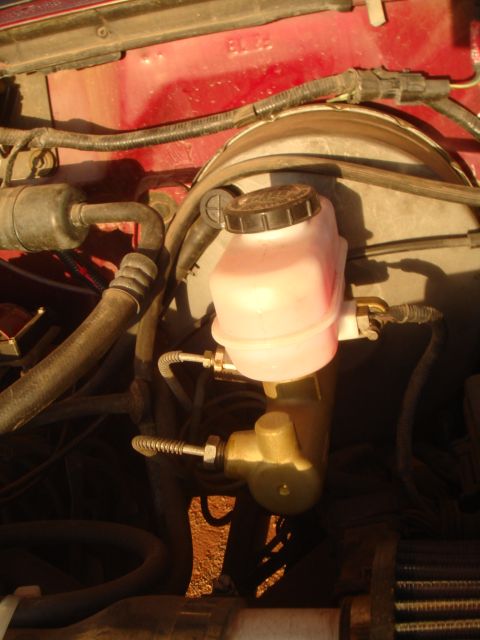 1992 Ford Bronco - Close-up view of the brake booster and master cylinder assembly in a 1992 Ford Bronco.