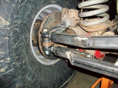 1992 Ford F-350 - Front wheel suspension and steering linkage detail on a vehicle.
