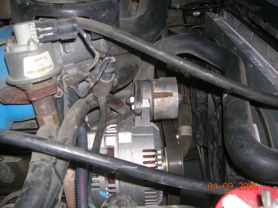Alternator and Ford-marked component in engine compartment