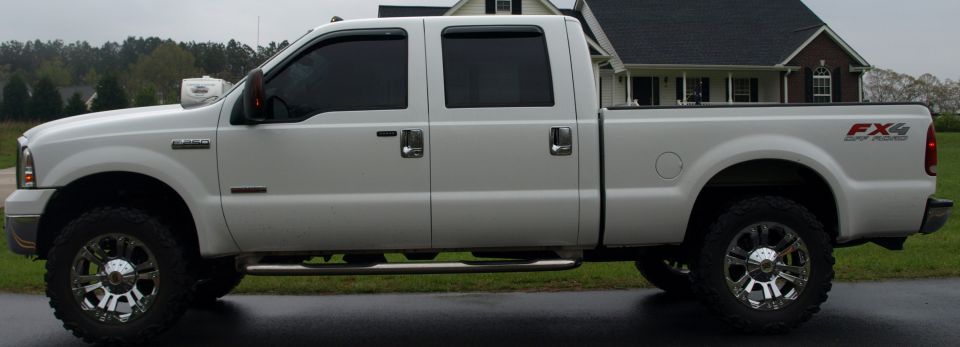 White 2006 Ford F-250 Super Duty FX4 pickup truck, side view
