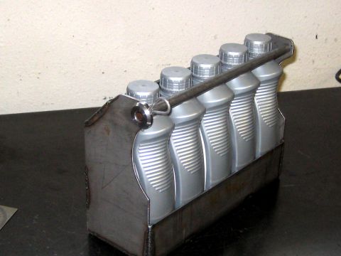 1996 Ford Bronco - Custom metal carrier designed to hold six bottles of motor oil.