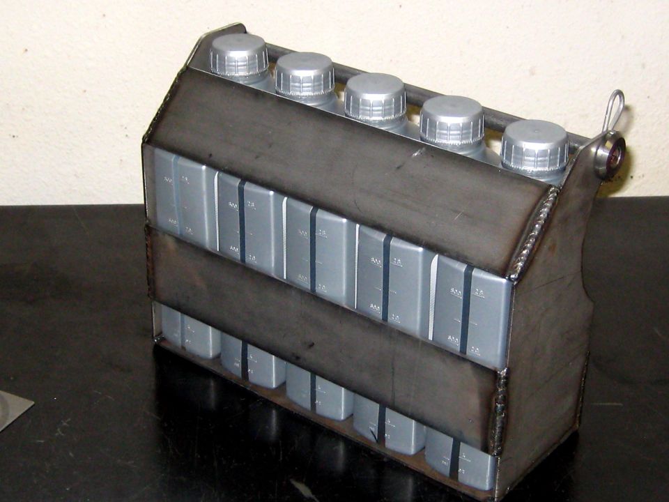 metal caddy holding many oil bottles