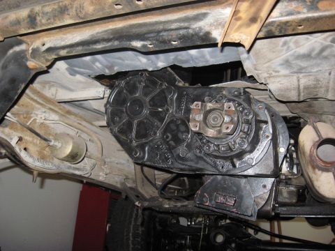 1991 Ford Bronco - Vehicle's transfer case and exhaust system shown from underneath.