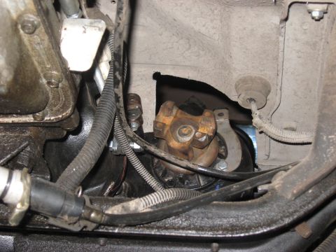 1991 Ford Bronco - Underside view of vehicle mechanical components, including a U-joint and starter motor.