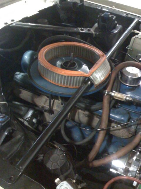 1992 Ford Bronco - Close-up view of an engine bay, showing the air filter and various engine components.