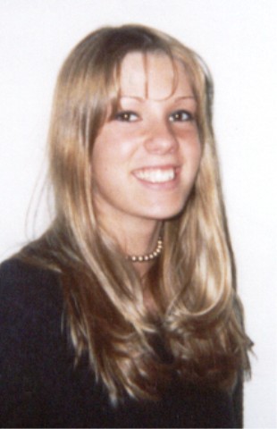 1990 Ford Taurus - A woman with blonde hair and a pearl necklace is pictured against a white background.