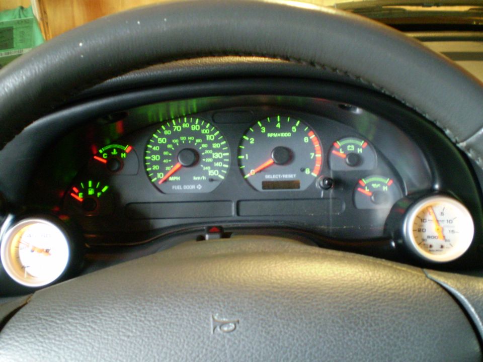 Dashboard gauges and steering wheel of a 2002 Ford Mustang