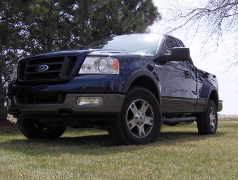2005 Ford F-150 - Front three-quarter view of a dark blue 2005 Ford F-150 truck with gray trim.