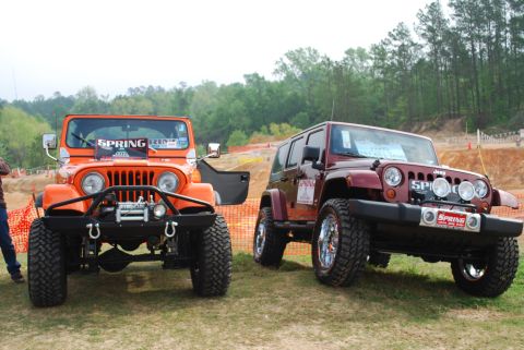 2008 Jeep Wrangler - Two Jeeps, one older CJ model and a newer JK model, are parked outdoors on a grassy area.