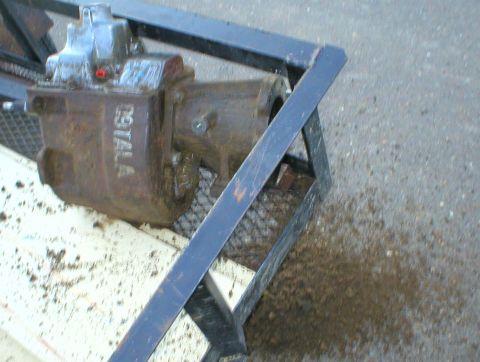 1983 Ford Bronco - It had ~1/2" of mud caked on all over the case, so I scraped most of it off. The pile on the ground is only from this side.