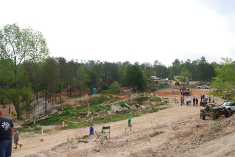 2008 Jeep Wrangler - A group of off-road vehicles and spectators are gathered at a dirt track event, possibly a meetup or off-road meetup.