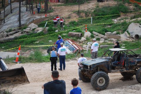 2008 Jeep Wrangler - Participants gather around a challenging off-road course with multiple vehicles and spectators.