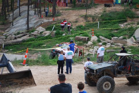 2008 Jeep Wrangler - Participants navigate a challenging off-road course during a competition, with spectators observing the action.