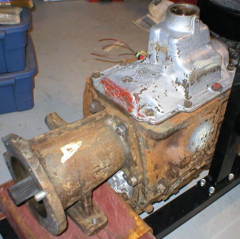 1983 Ford Bronco - This is a close-up of a rusty NP-435 transmission, likely for a truck or SUV.