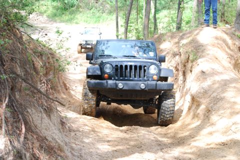 2008 Jeep Wrangler - Two Jeep Wranglers navigate a challenging off-road trail during a meetup.